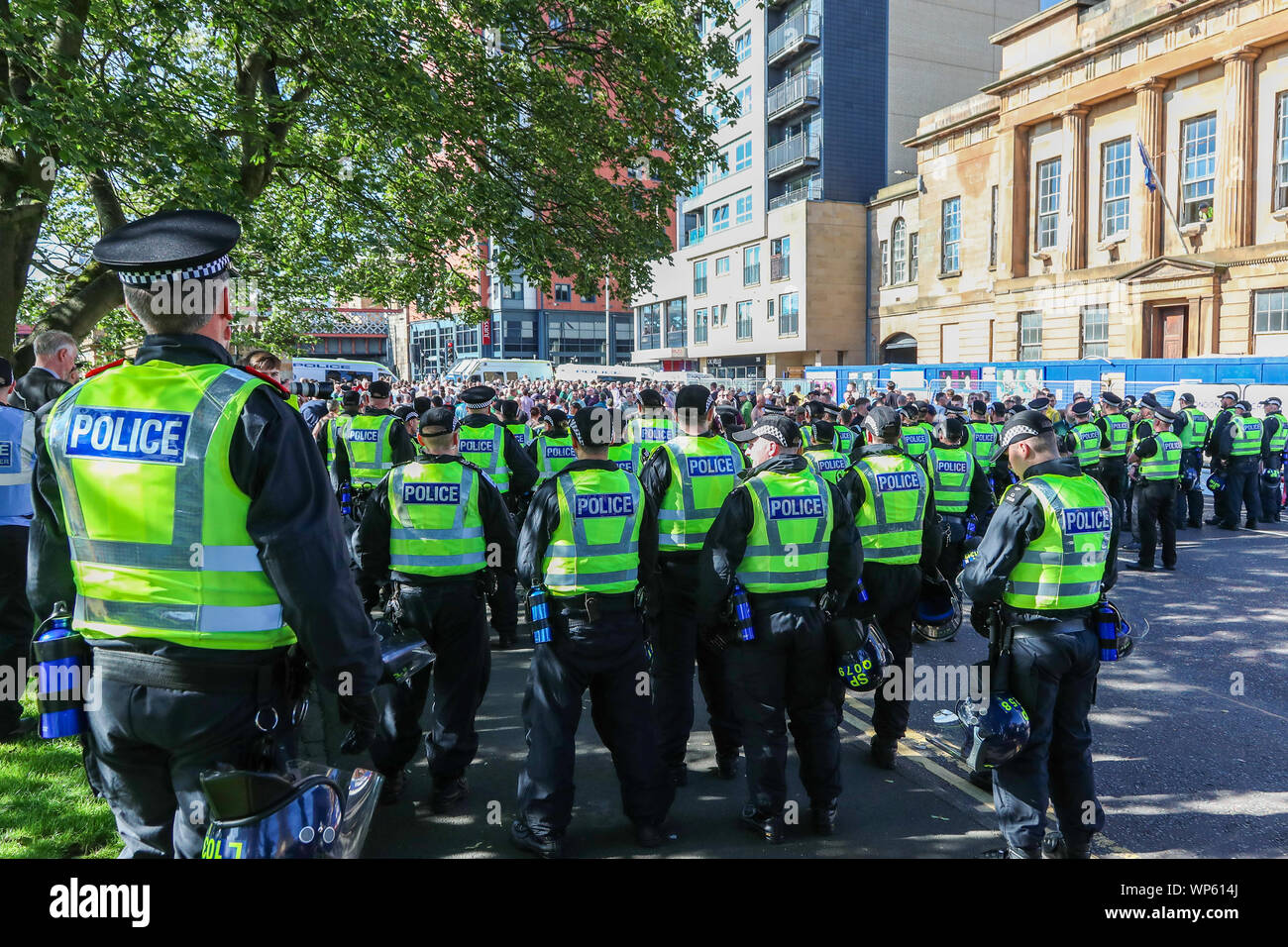 Glasgow, UK 07 September 2019. The Pro-Republican, Pro Irish group, the Calton Republicans marched through Glasgow's east end from Millroad Street to Clyde Street and stopped at the anti fascist statue celebrating the people of Glasgow who fought against Franco in the Spanish civil war. After the recent and significant street disturbances in Govan between sectarian groups there was a heavy police presence to prevent any disorder. Credit: Findlay/Alamy News Stock Photo