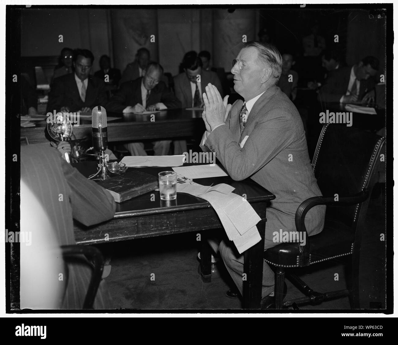 Knox before Senate committee considering his qualifications to be Secretary of Navy. Washington, D.C., July 2. Col. Frank Knox, recently nominated to be secretary of the Navy, appeared before the Senate Naval Affairs Committee today and denied charges the he is an advocate of armed intervention in the European War, 7-2-40 Stock Photo