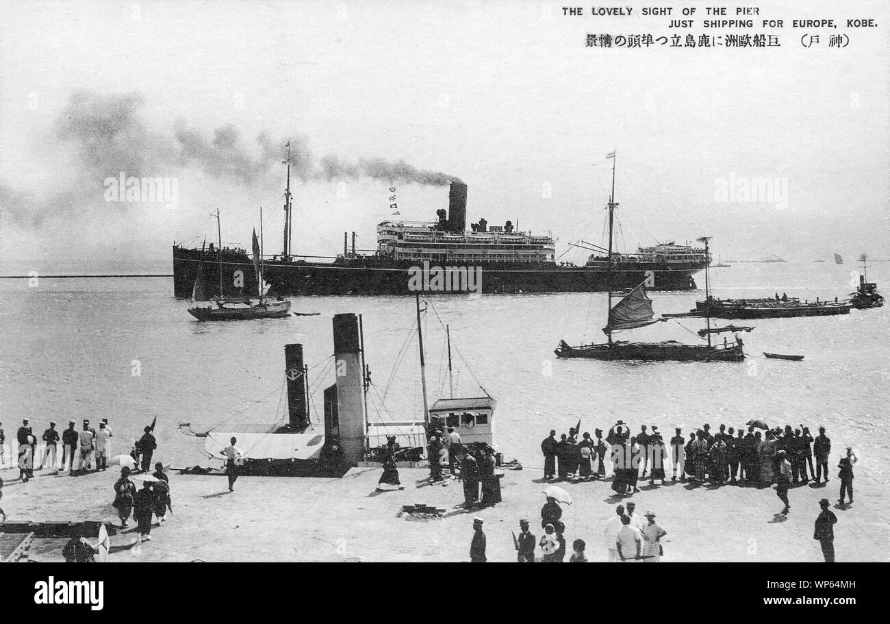 [ 1920s Japan - Steam Ship in Kobe Harbor ] —   A small crowd of people watch a steam ship at Kobe Harbor.  20th century vintage postcard. Stock Photo