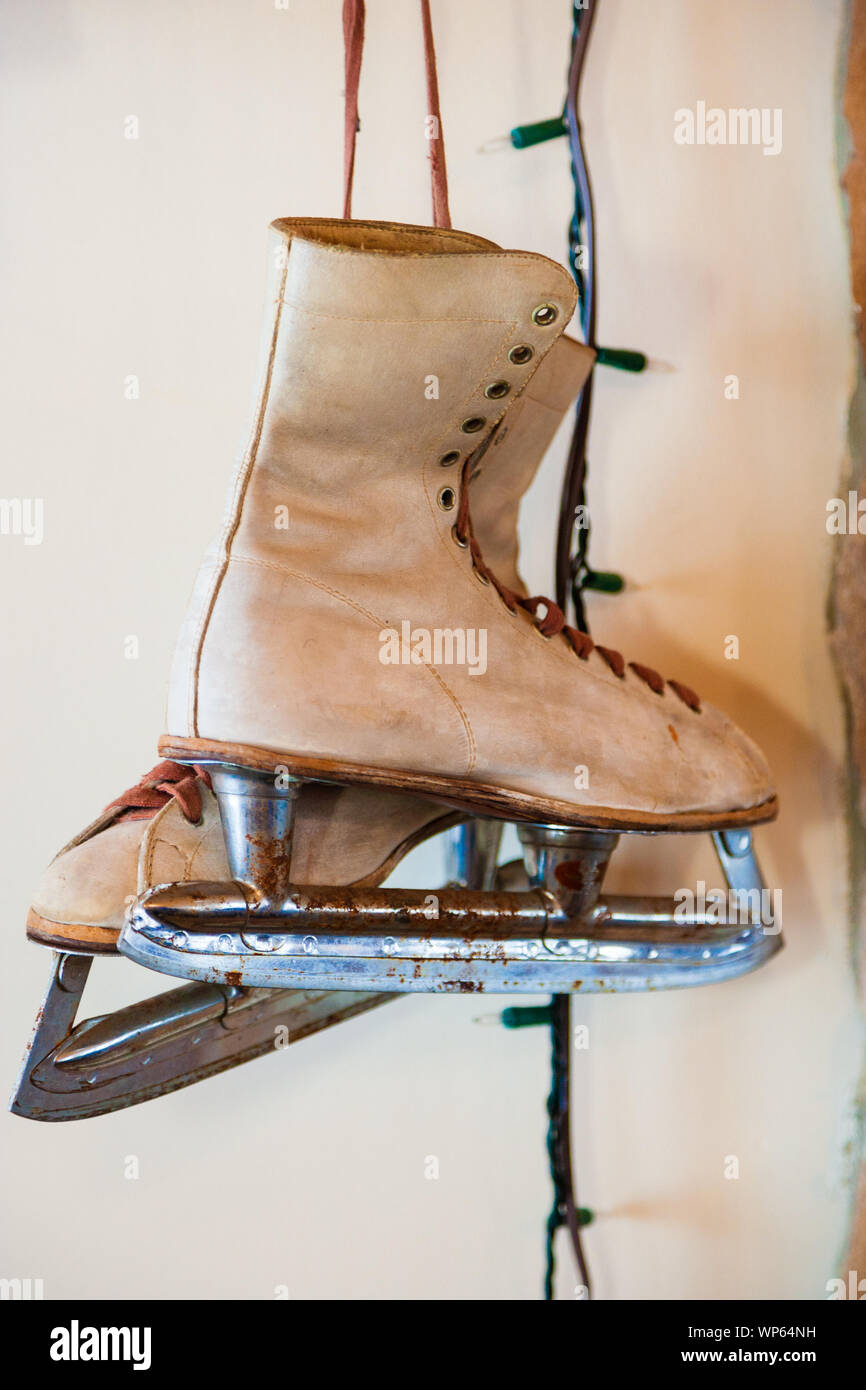 Antique ice skates hanging on the wall Stock Photo Alamy