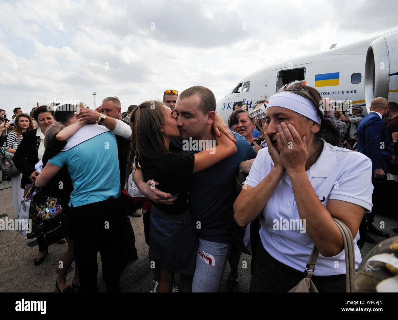 Relatives meet former Ukrainian prisoners freed by Russia at Boryspil International Airport after the exchange of prisoners between Russia and Ukraine.An airplane with liberated Ukrainians landed at Boryspil International Airport. Between Ukraine and Russia held an exchange of withheld persons in the format of 35 to 35. Stock Photo