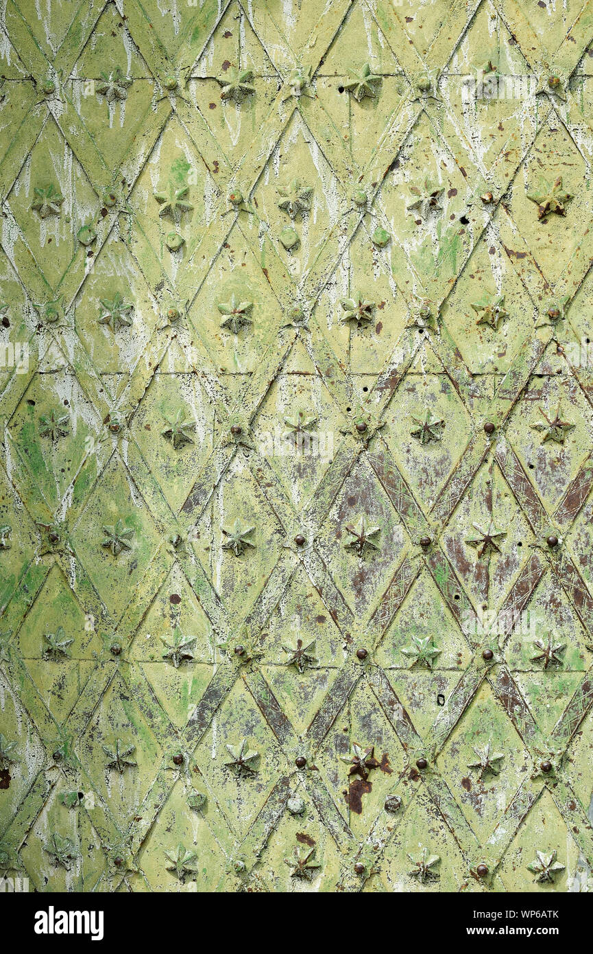 Old medieval metal gate texture. Green grunge background Stock Photo