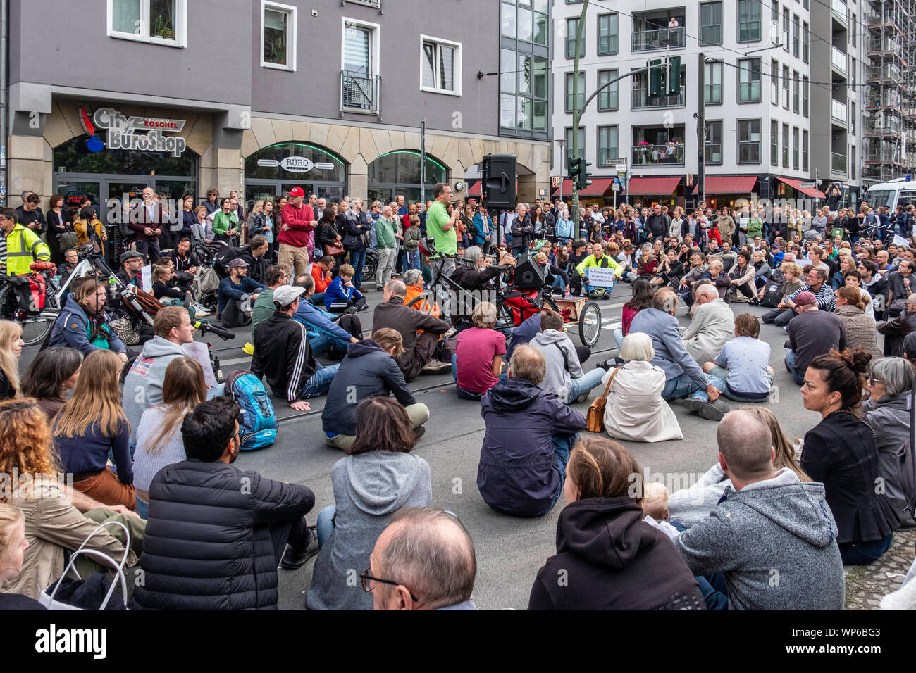 Germany, Berlin, Cnr. Invalidenstrasse & Ackerstrasse. 7th September 2019.Vigil for four people killed in accident as a Porche SUV ploughed onto sidewalk of Friday evening. Berliners gathered to mourn the dead and bring flowers & candles to the site of the accident. There was also a call for SUV vehicles to be restricted in the city and for a new speed limit. credit: Eden Breitz/Alamy Stock Photo