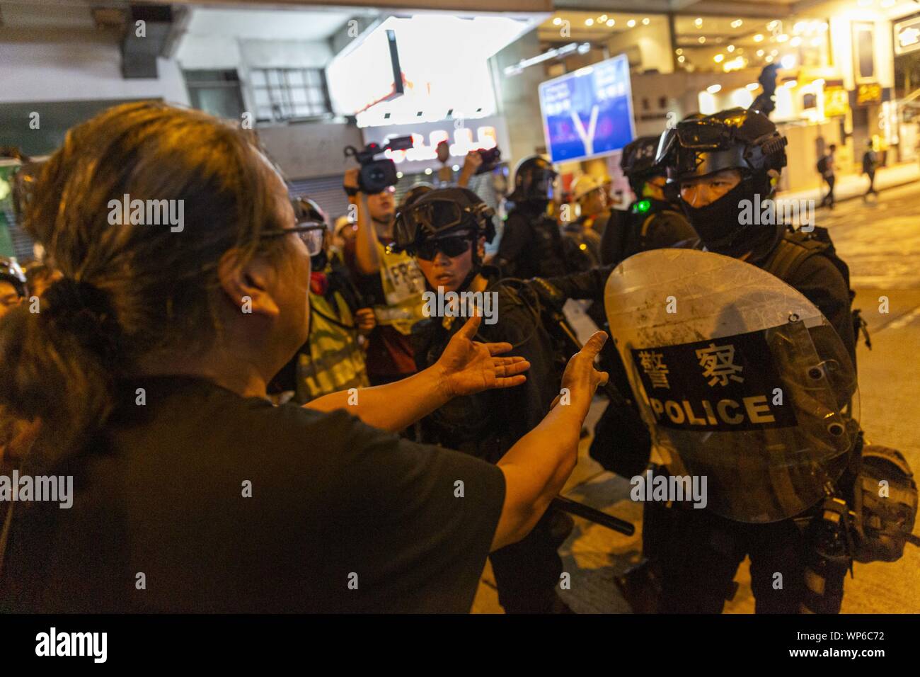 Hong Kong, China. 7th Sep, 2019. A pro democracy protester implores police to show restraint as he walks towards them. Hundred of protesters and members of the publicgathered for yet another night in front of the Mongkok police station in order to continue demanding the release of the cctv footage from the Prince Edward MTR station, the site of an alleged brutal police crackdown on suspected protesters and members of the public. Credit: Adryel Talamantes/ZUMA Wire/Alamy Live News Stock Photo