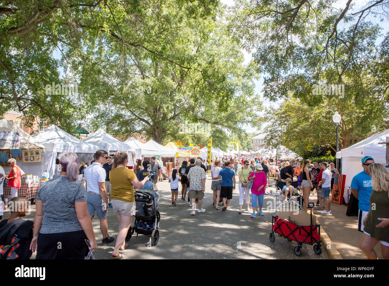 MATTHEWS, NC (USA) - September 2, 2019: Visitors to the annual 'Matthews Alive' community festival mob the area where arts and crafts are sold. Stock Photo