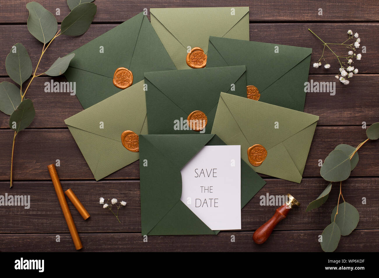 Composition of wedding envelopes with invitations on wood Stock Photo