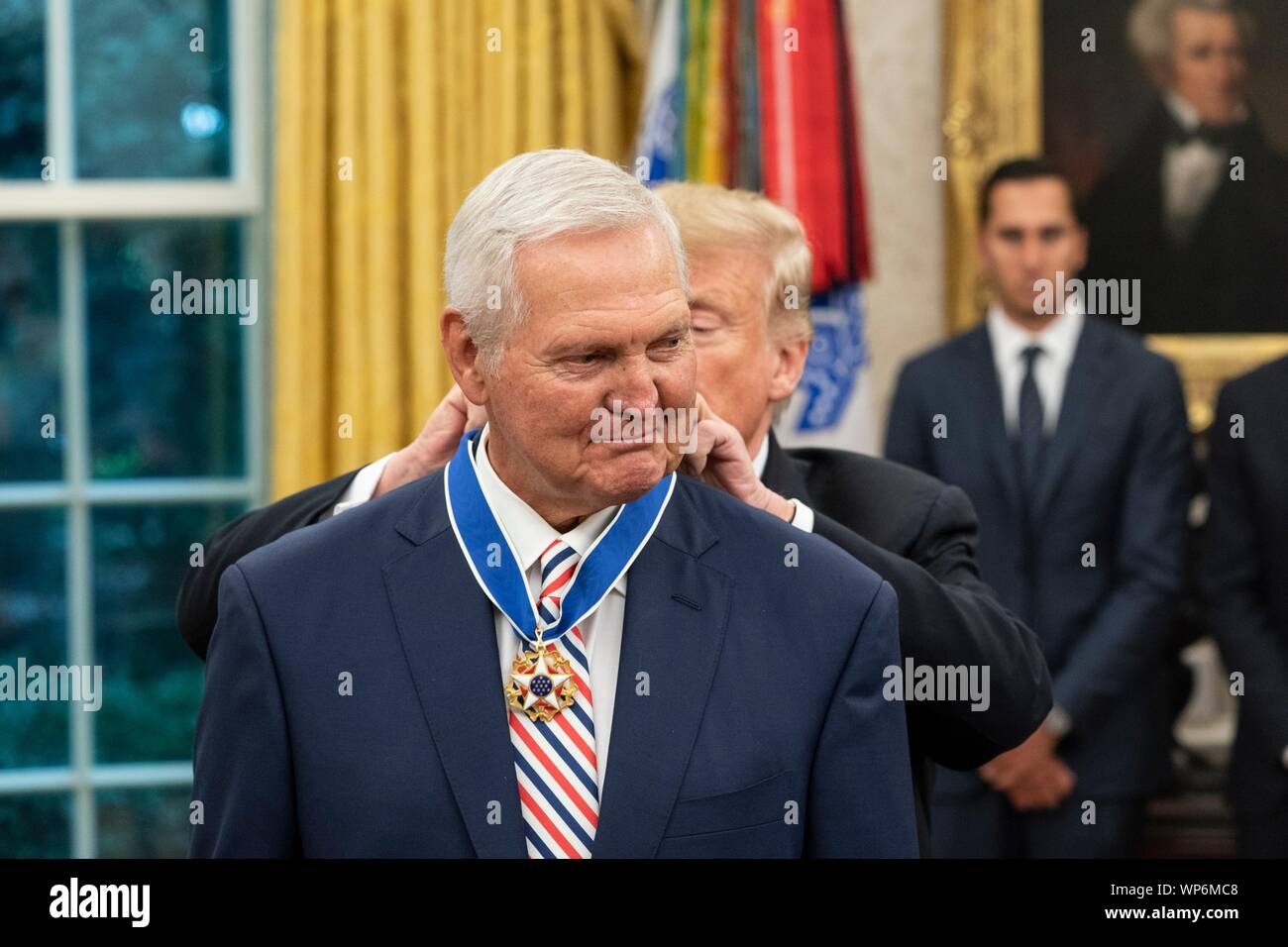 Washington, DC, USA. 05 September, 2019. U.S President Donald Trump, right, awards the Presidential Medal of Freedom, to Hall of Fame Los Angeles Lakers basketball star and legendary NBA General Manager Jerry West during a ceremony in the Oval Office of the White House September 5, 2019 in Washington, DC. Stock Photo