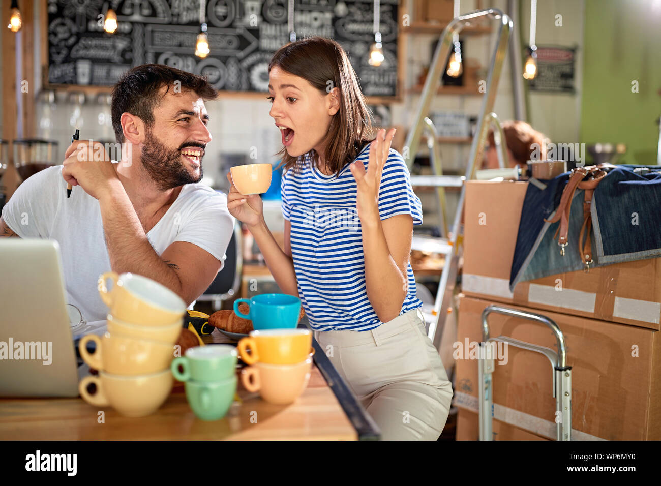 Woman employee in apron opens hi-res stock photography and images - Alamy