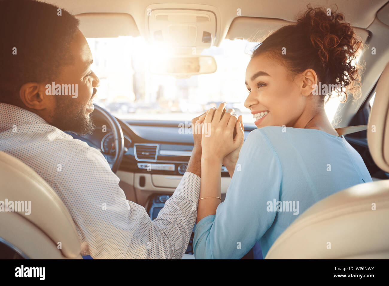 Travel by car. Happy african american couple holding hands Stock Photo ...