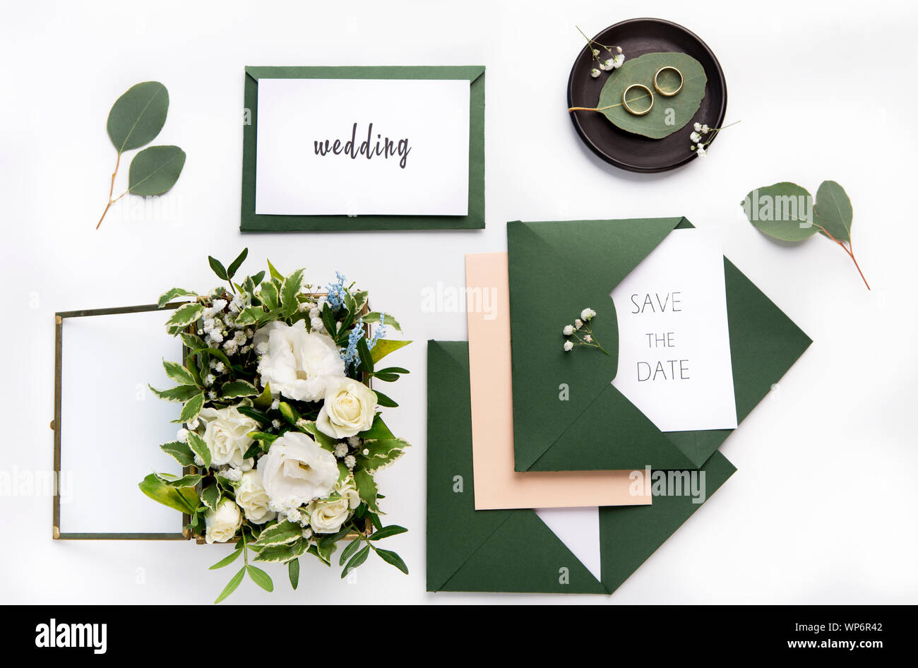 Craft green wedding envelopes with invitations on white Stock Photo Alamy