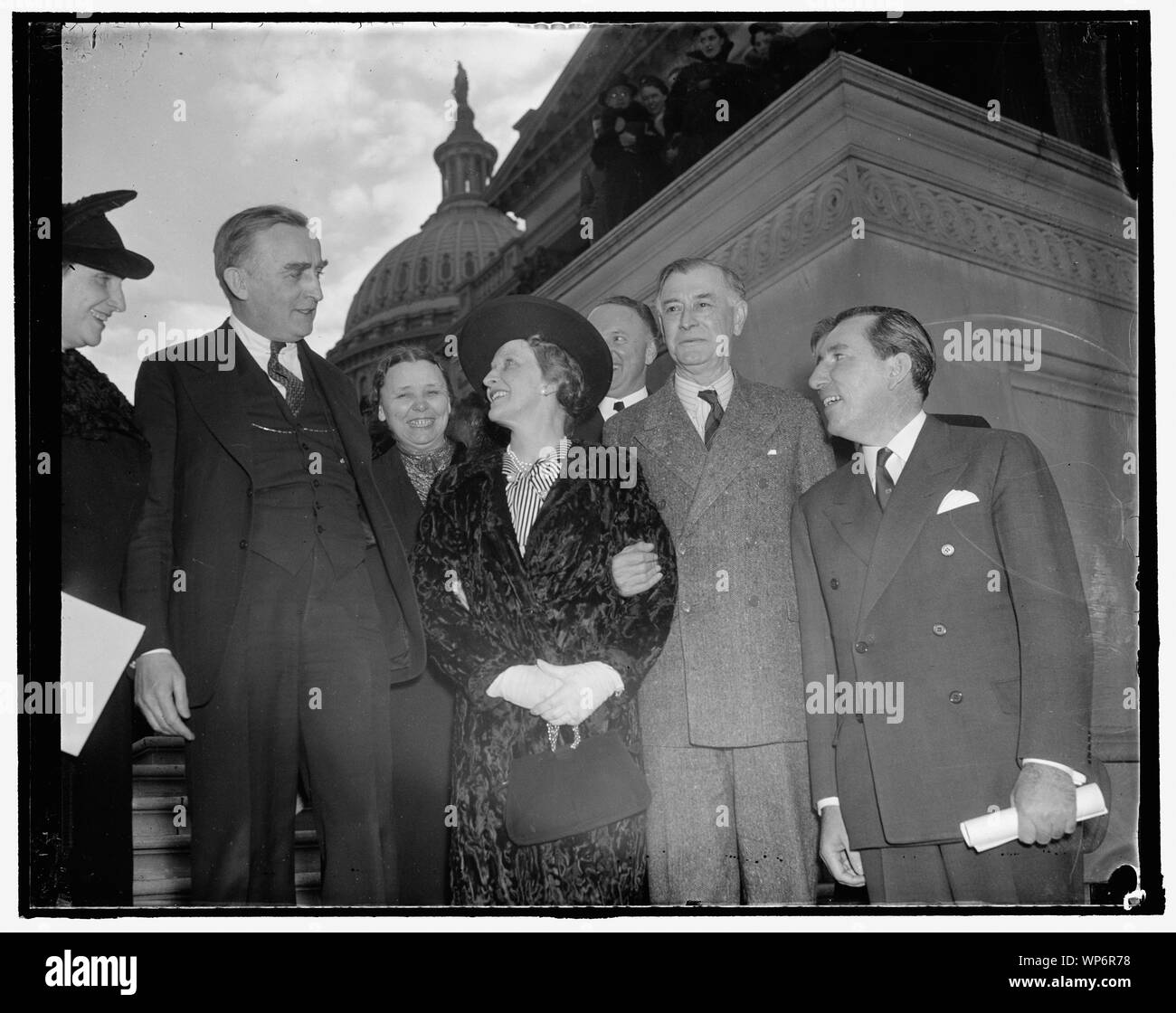 Lady Astor welcomed at Capitol. Washington, D.C., Jan. 27. Lady Astor, the former Nancy Langhorne of Virginia and now a member of the British Parliament, received a warm welcome when she looked in on the United States Senate today. In the photograph, left to right: Senator Joseph O'Mahoney, Senator Hattie Caraway, Lady Astor, Senator Harry Byrd, Senator Key Pittman, and Senator Claude A. Pepper, 1/27/38 Stock Photo