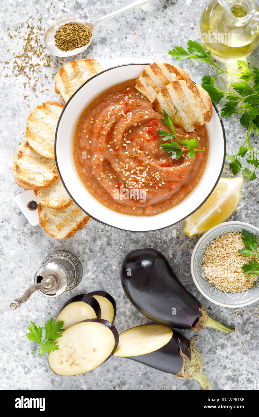 Eggplant hummus with ingredients for cooking. Traditional vegan arabic