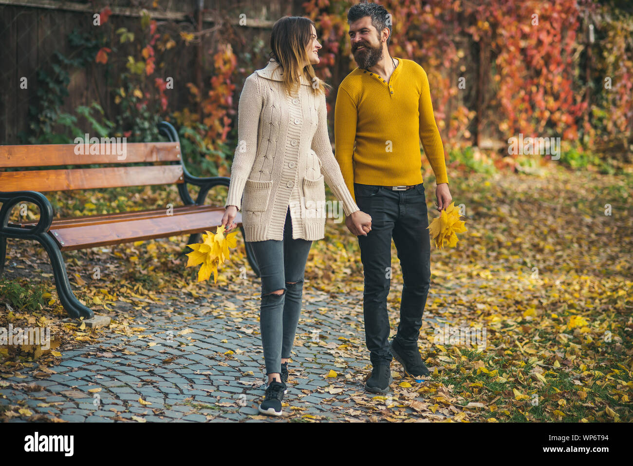 Love relationship and romance. Couple in love in autumn park. Autumn happy couple of girl and ...