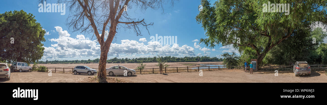KRUGER NATIONAL PARK, SOUTH AFRICA - MAY 15, 2019: Crooks Corner with Zimbabwe visible accross the Limpopo River. Mozambique lies behind the tree to t Stock Photo