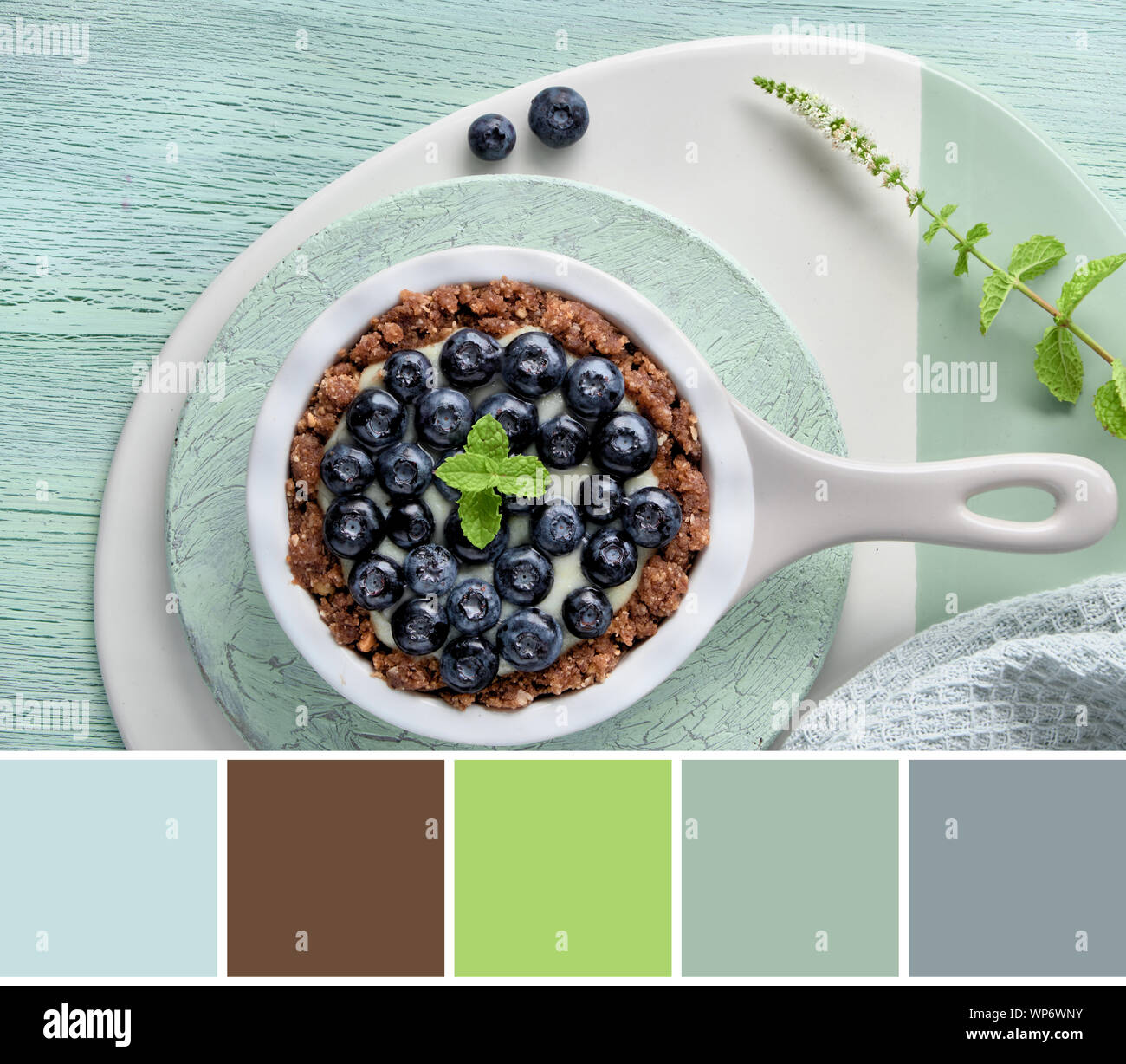 Color matching palette from top view image of blueberry tart on crackled mint background Stock Photo