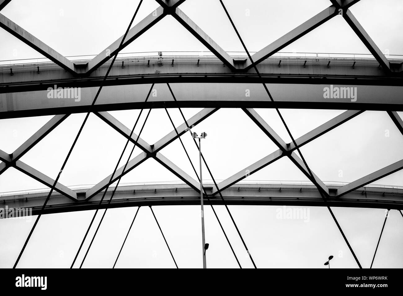 Structure of steel beams and cables in black and white Stock Photo