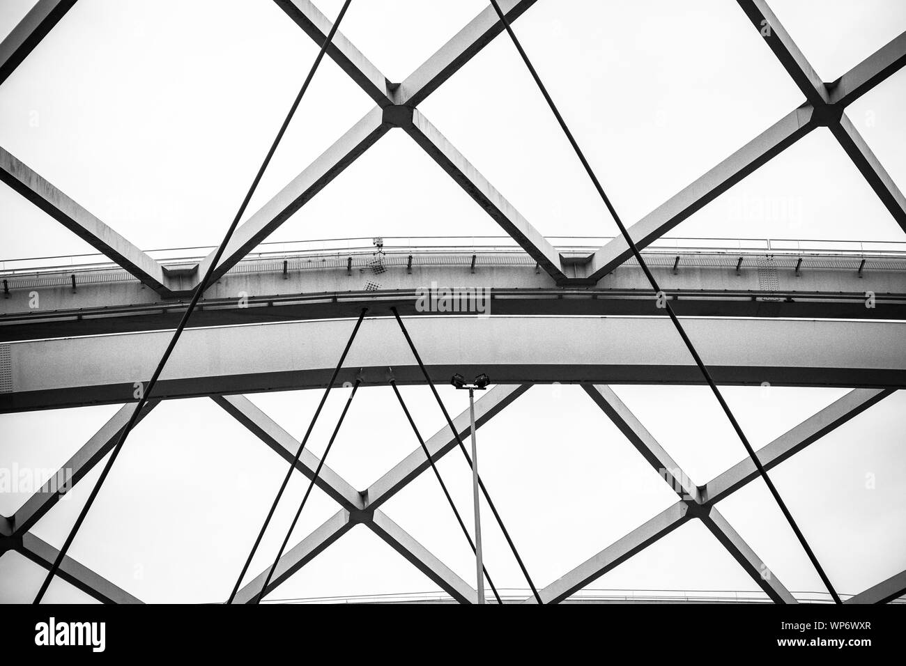 Structure of steel beams and cables in black and white Stock Photo