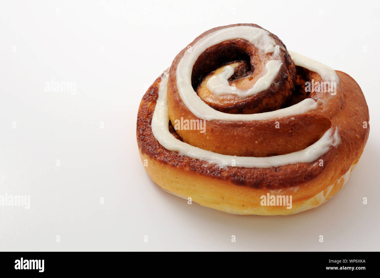 Cinnamon roll closeup isolated on white background Stock Photo - Alamy
