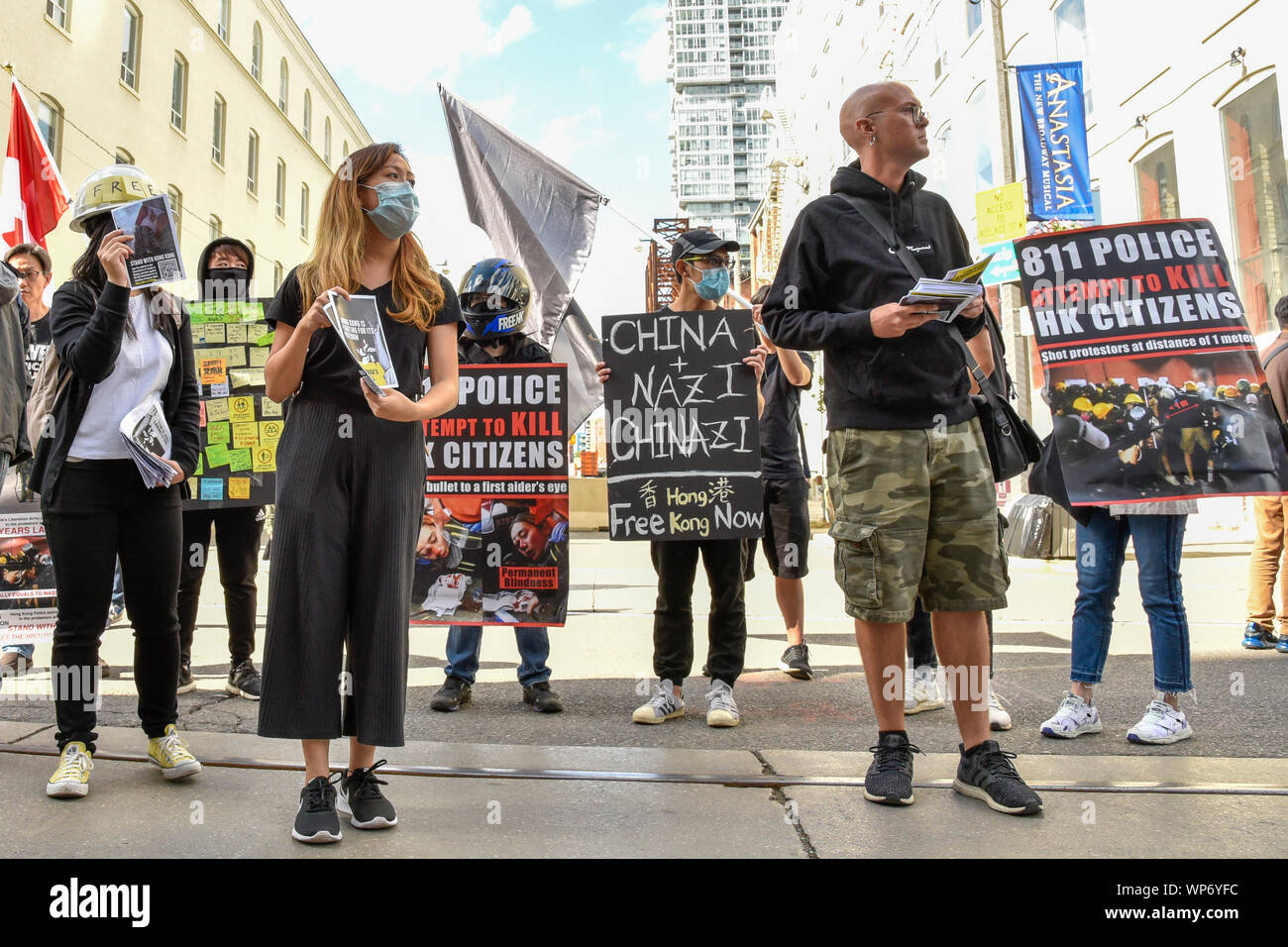 September 7, 2019 - Toronto, Canada - "Free Hong Kong" Anti-Extradition Bill protesters dress in all black similar to the protesters in Hong Kong rally on King Street during the 2019 Toronto International Film Festival.  Dominic Chan/EXimages Stock Photo