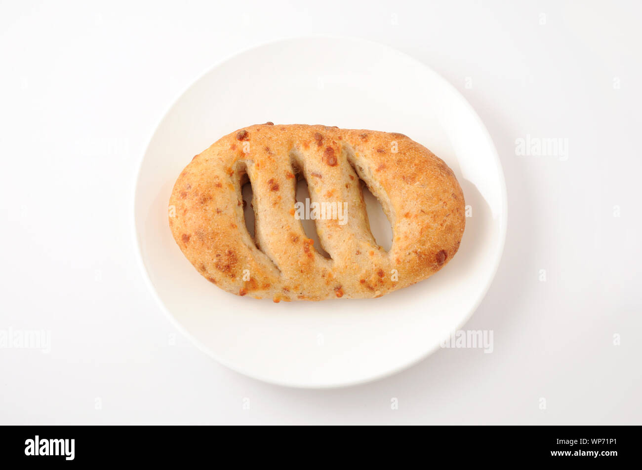 french bread on plate closeup isolated on white background Stock Photo ...