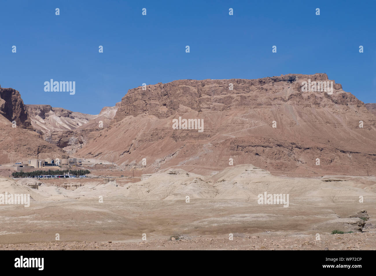 Israel, historic Masada aka Massada. Mountain view with Welcome Center on lower left. Stock Photo