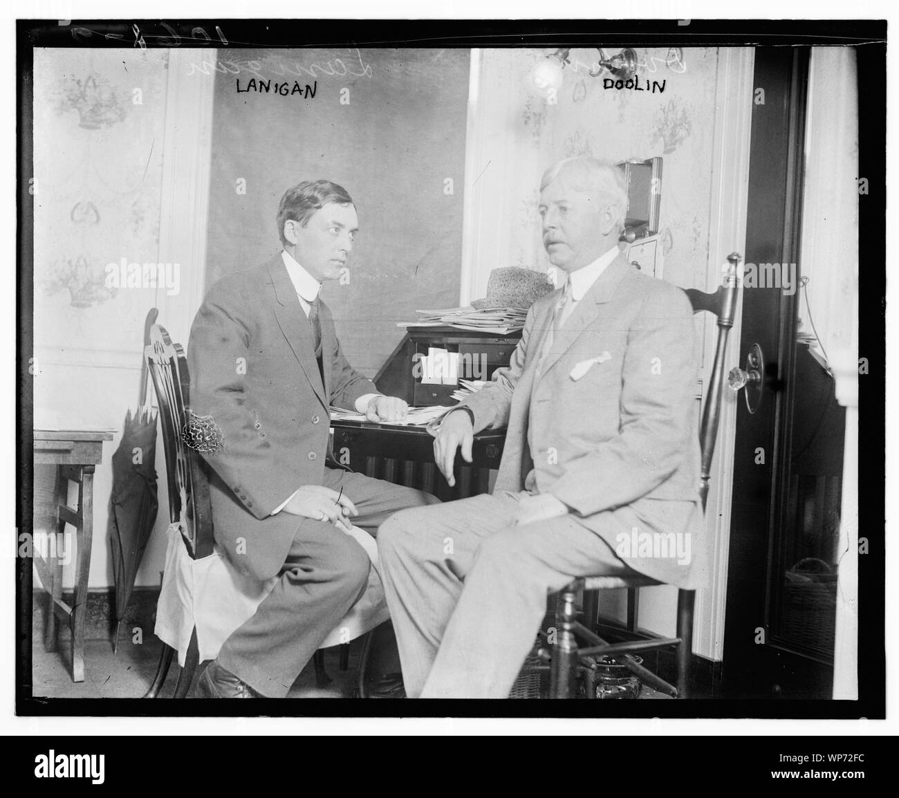 Lanigan and Doolin at desk Stock Photo Alamy