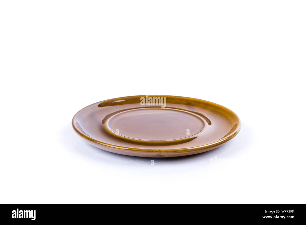 isolated brown saucer on white background Stock Photo Alamy
