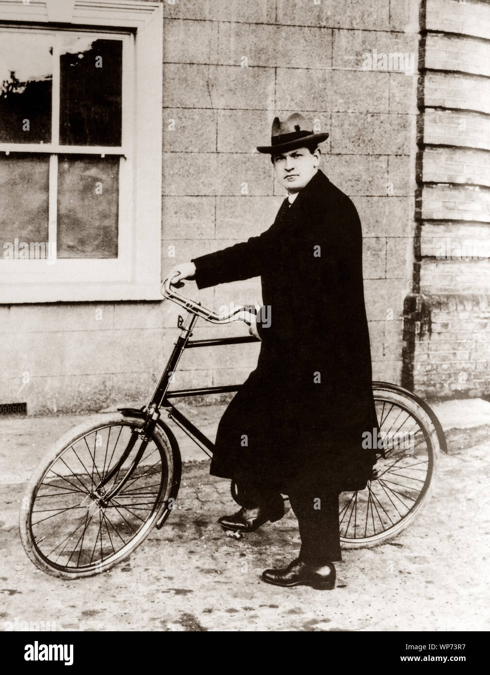 Michael Collins (1890 – 1922), Irish revolutionary, soldier and politician who was a leading figure in the early-20th-century Irish struggle for independence with his  'high nelly' Rudge Whitworth bicycle. Collins was Chairman of the Provisional Government of the Irish Free State from January 1922 until his assassination in August 1922. Stock Photo