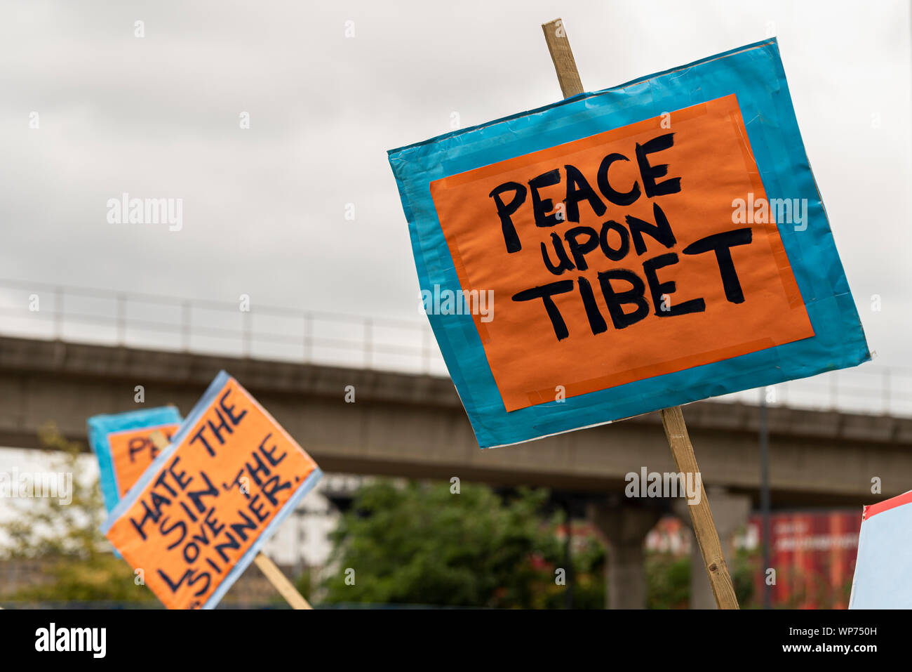 Peace upon Tibet placard at Defence & Security Equipment International DSEI arms fair trade show, ExCel, London, UK. Space for copy Stock Photo