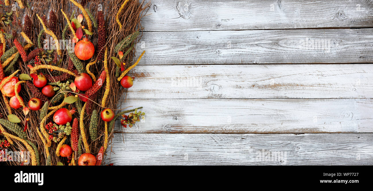 Thanksgiving decorations on left side of white rustic wood Stock Photo