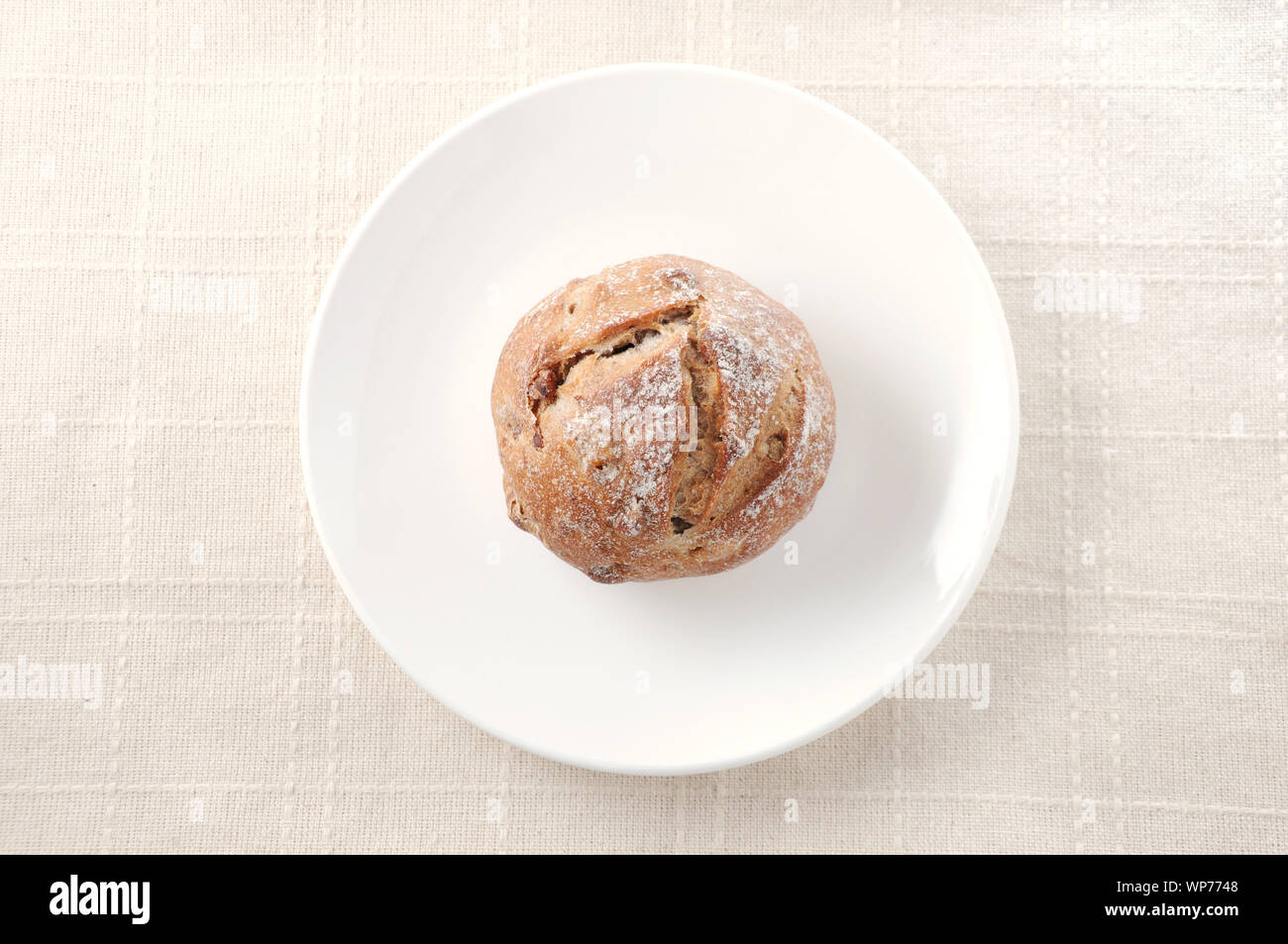 french bread on plate isolated on table cloth Stock Photo - Alamy