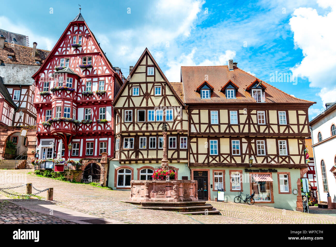 Colorful half-timbered houses on the market place (Alter Marktplatz) in old german town Miltenberg am Main river. Odenwald, Bavaria, Germany Stock Photo