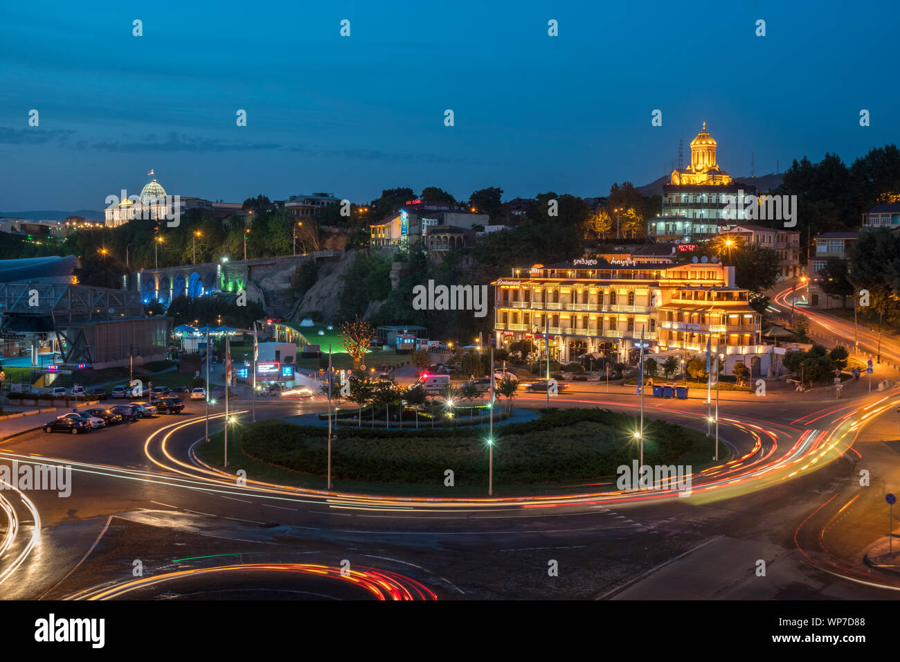 Tbilisi, Georgia - 30.08.2018: Night view over Europe square and Holy trinity Sameba church in the background. Travel. Stock Photo