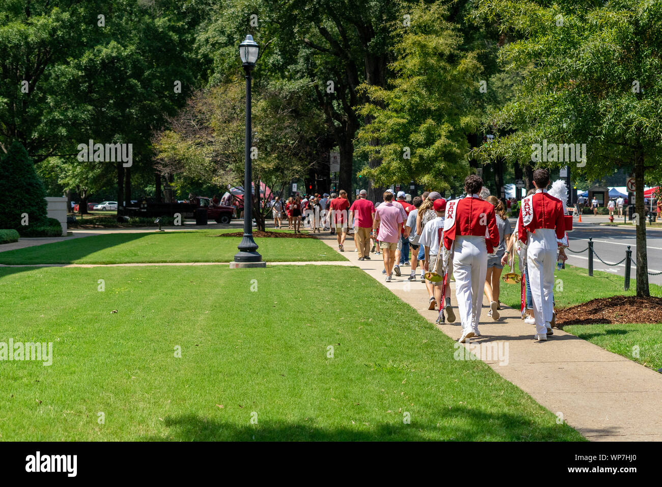 Tuscaloosa, Alabama, USA. 7th Sep, 2019. The sidewalks on the campus of the University of Alabama were full of football fans and band members walking about two miles to the stadium. The people were in Tuscaloosa, Alabama on Saturday, September 7th, 2019 for the Alabama vs New Mexico game. (Credit Image: © Tim ThompsonZUMA Wire) Stock Photo