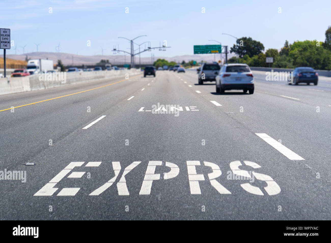 Express Lane marking on the freeway; San Francisco Bay Area, California; Express lanes help manage lane capacity by allowing single occupancy vehicles Stock Photo