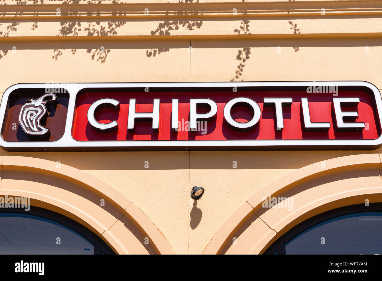 August 15, 2019 San Mateo / CA / USA - Close up of Chipotle sign at one of their restaurant location in San Francisco Bay; Chipotle Mexican Grill, Inc Stock Photo