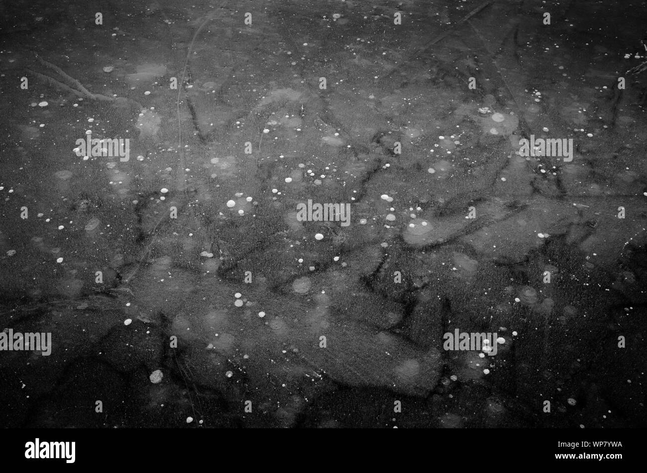 Patterns in the ice of a frozen lake in winter Stock Photo Alamy