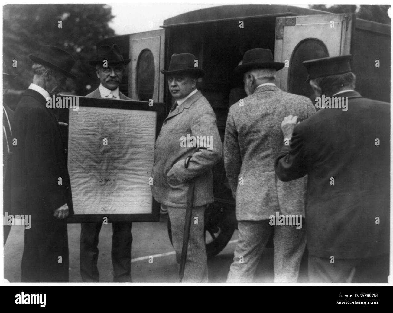 Library of Congress officials transferring page 3 of the United States Constitution from the State Department to the Library of Congress in the Library's Model-T Ford mail wagon Stock Photo