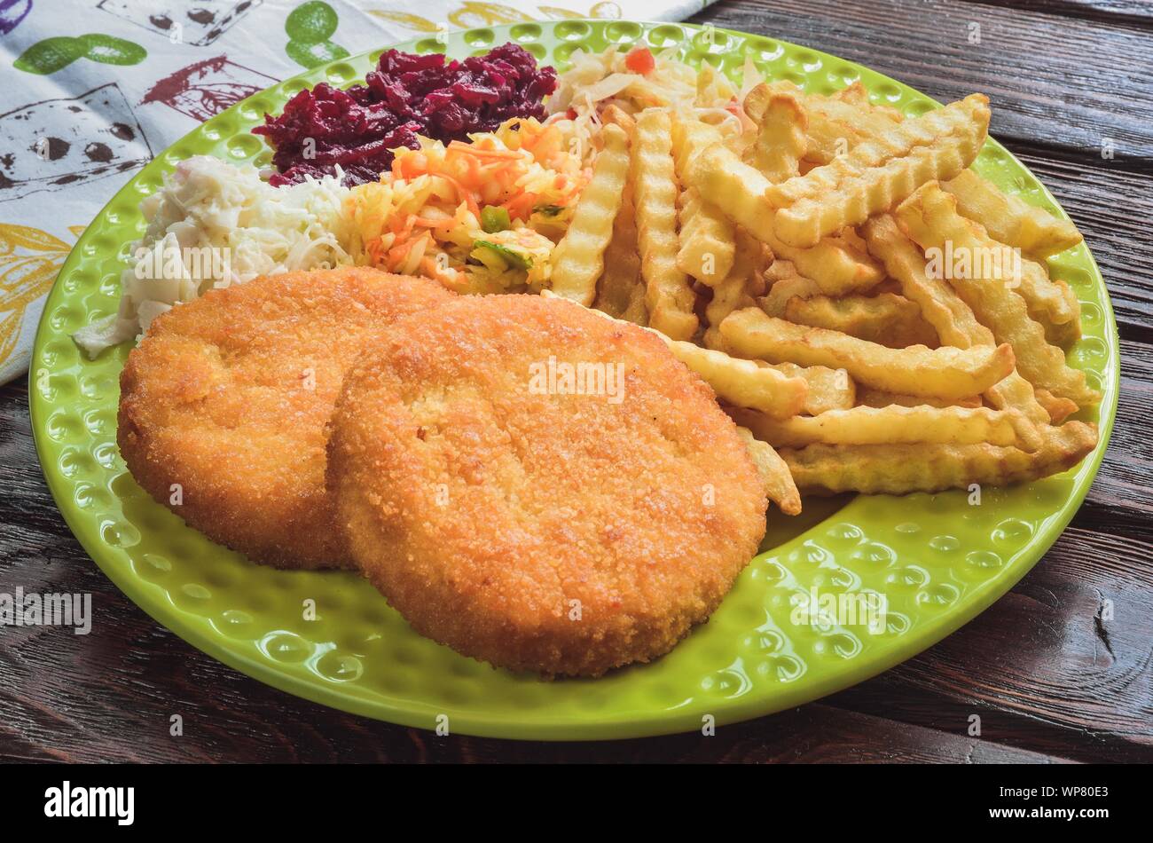 Tasty hot dinner. Quick dinner to prepare on a wooden table. Stock Photo