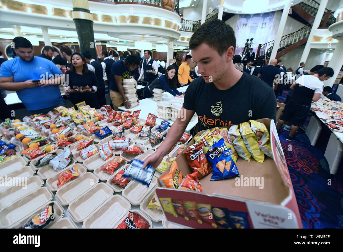 Freeport, The Bahamas. 06th Sep, 2019. September 6, 2019 - Freeport, Grand Bahama, Bahamas - Royal Caribbean International employees aboard the cruise ship Mariner of the Seas prepare 20,000 meals for the victims of Hurricane Dorian on September 6, 2019 as the ship cruises to Freeport, Grand Bahama where the meals will be distributed. Hurricane Dorian hit the island chain as a category 5 storm, battering them for two days before moving north. Credit: Paul Hennessy/Alamy Live News Stock Photo