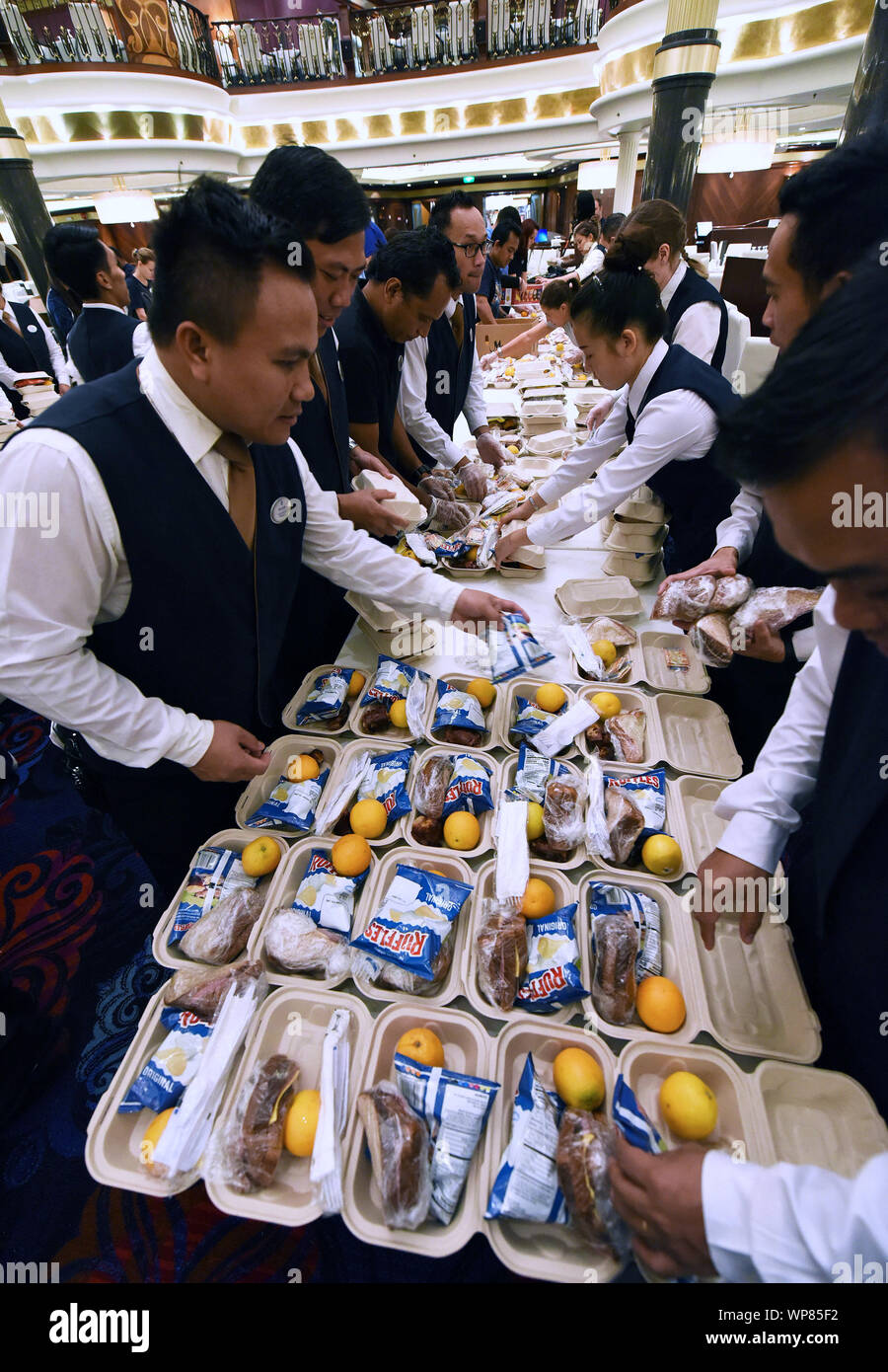 Freeport, The Bahamas. 06th Sep, 2019. September 6, 2019 - Freeport, Grand Bahama, Bahamas - Royal Caribbean International employees aboard the cruise ship Mariner of the Seas prepare 20,000 meals for the victims of Hurricane Dorian on September 6, 2019 as the ship cruises to Freeport, Grand Bahama where the meals will be distributed. Hurricane Dorian hit the island chain as a category 5 storm, battering them for two days before moving north. Credit: Paul Hennessy/Alamy Live News Stock Photo