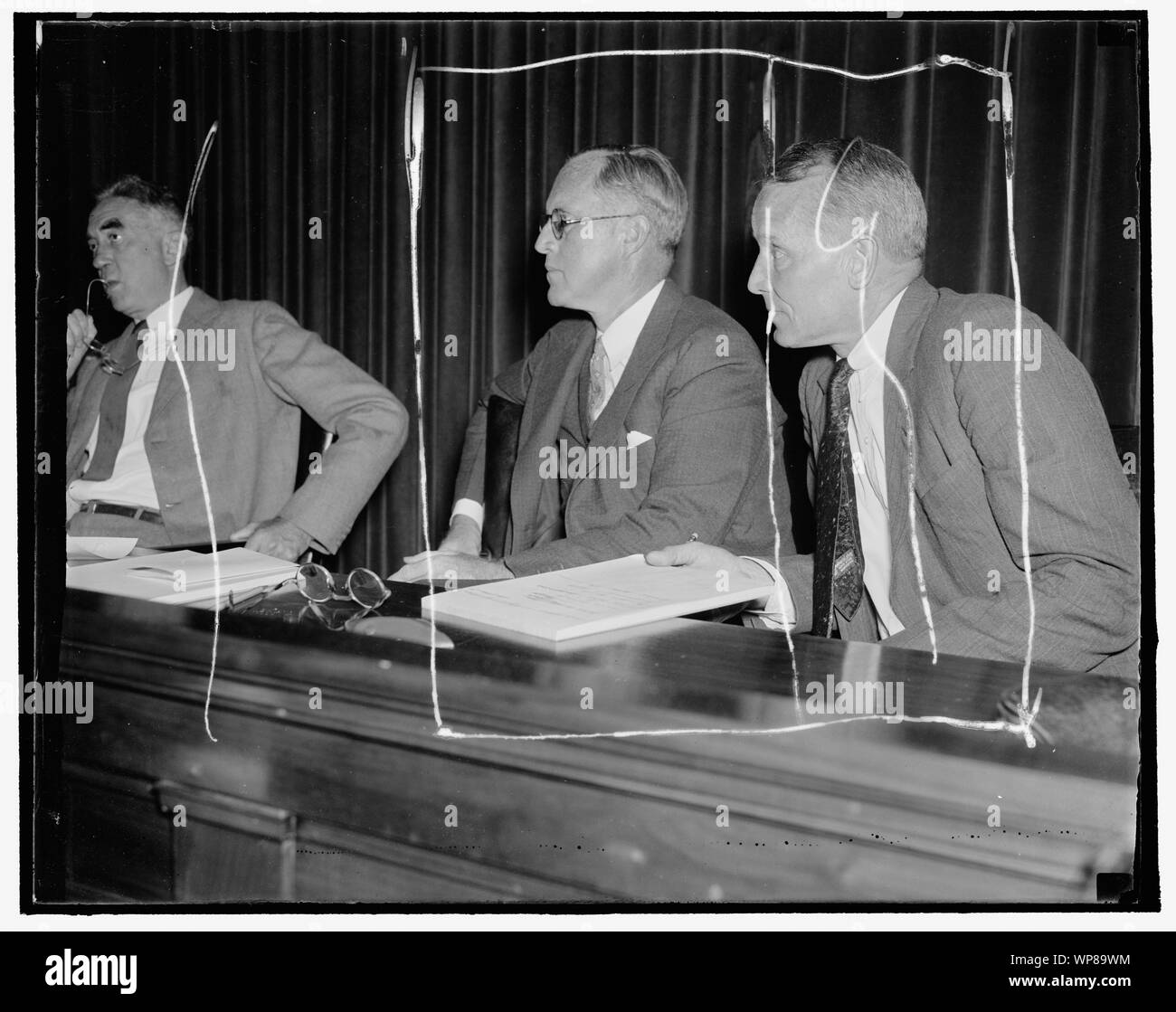 Listen to maritime troubles. Washington, D.C. Aug. 23. Chairman Joseph P. Kennedy, (left) and Commissioner Emory S. Land listen intently as maritime labor chiefs testify at the initial hearing of the U.S. Maritime Commission today in efforts to determine methods to avoid costly industrial labor disputes which have hampered the American Merchant Marine. 8/23/37 Stock Photo