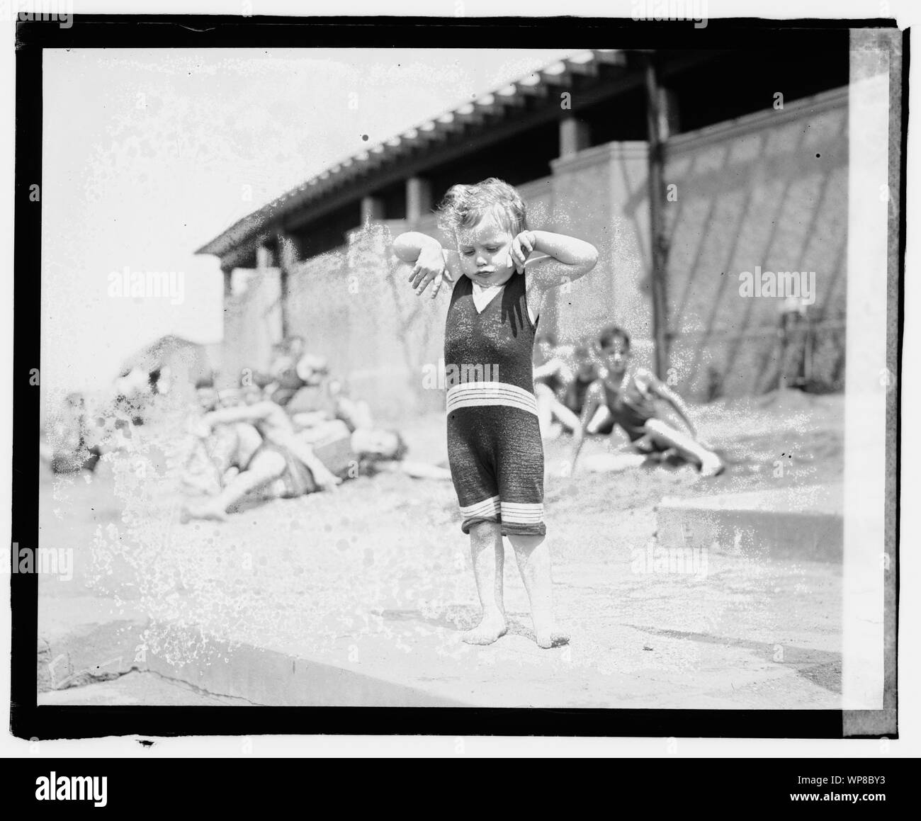 Lloyd Eller, son of Bob Eller; Lloyd Eller, the little son of Bob Eller, former Georgetown Athlete and famous hurdler snaped [sic] at the Washington bathing beach. Lloyd is showing the photographer how Daddy teaches him to throw out his chest.; Stock Photo