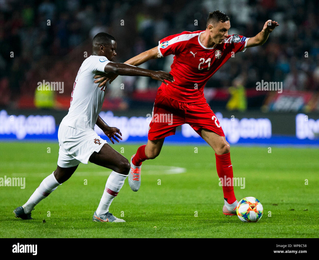 7th September 2019; Stadion Rajko Mitic, Belgrade, Serbia; European Championships 2020 Qualifier, Serbia versus Portugal; Milan Pavkov of Serbia competes against William Carvalho of Portugal - Editorial Use Only. Stock Photo