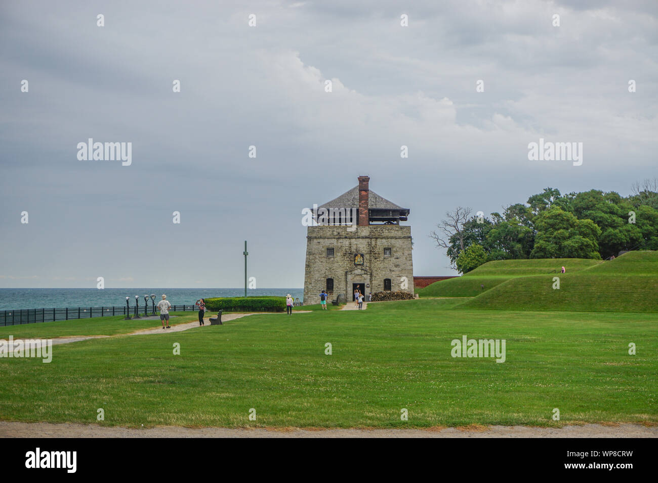 Porter, New York, USA: Visitors at the North Redoubt on the 23-acre grounds of Old Fort Niagara, on a cloudy day on Lake Ontario. Stock Photo