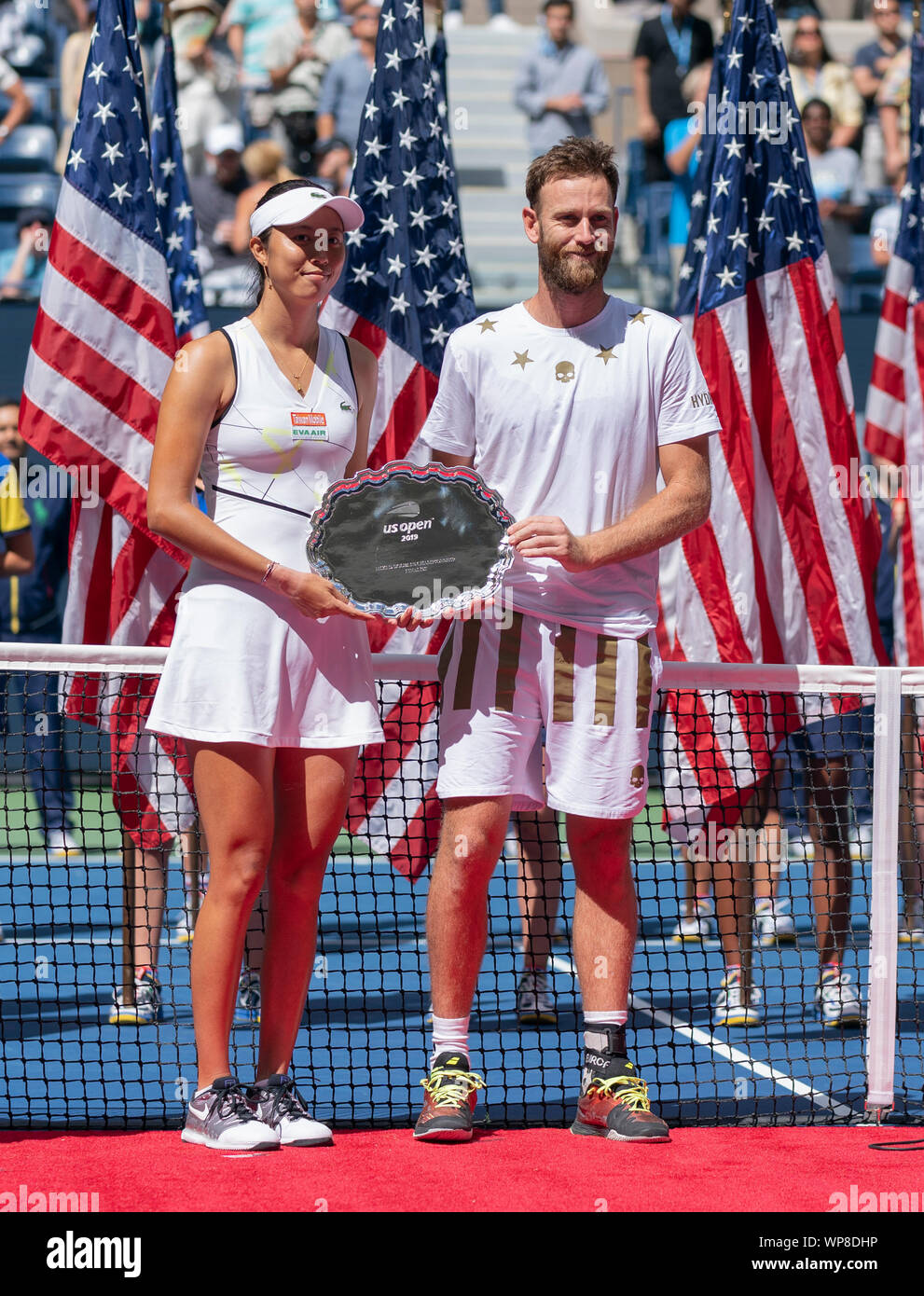 New York, NY - September 7, 2019: Hao-Ching Chan (Taipei), Michael Venus (New Zeland) pose with runner-up trophy mixed doubles final match at US Open Championships at Billie Jean King National Tennis Center Stock Photo