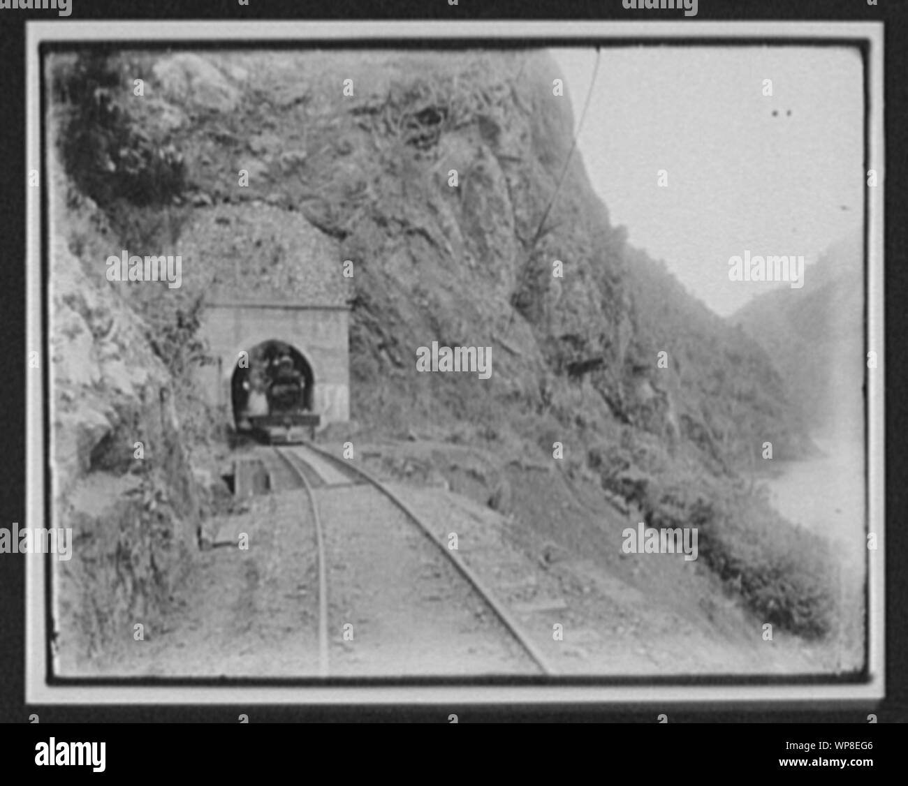 Locomotive in mouth of tunnel - Manawatu Gorge Stock Photo