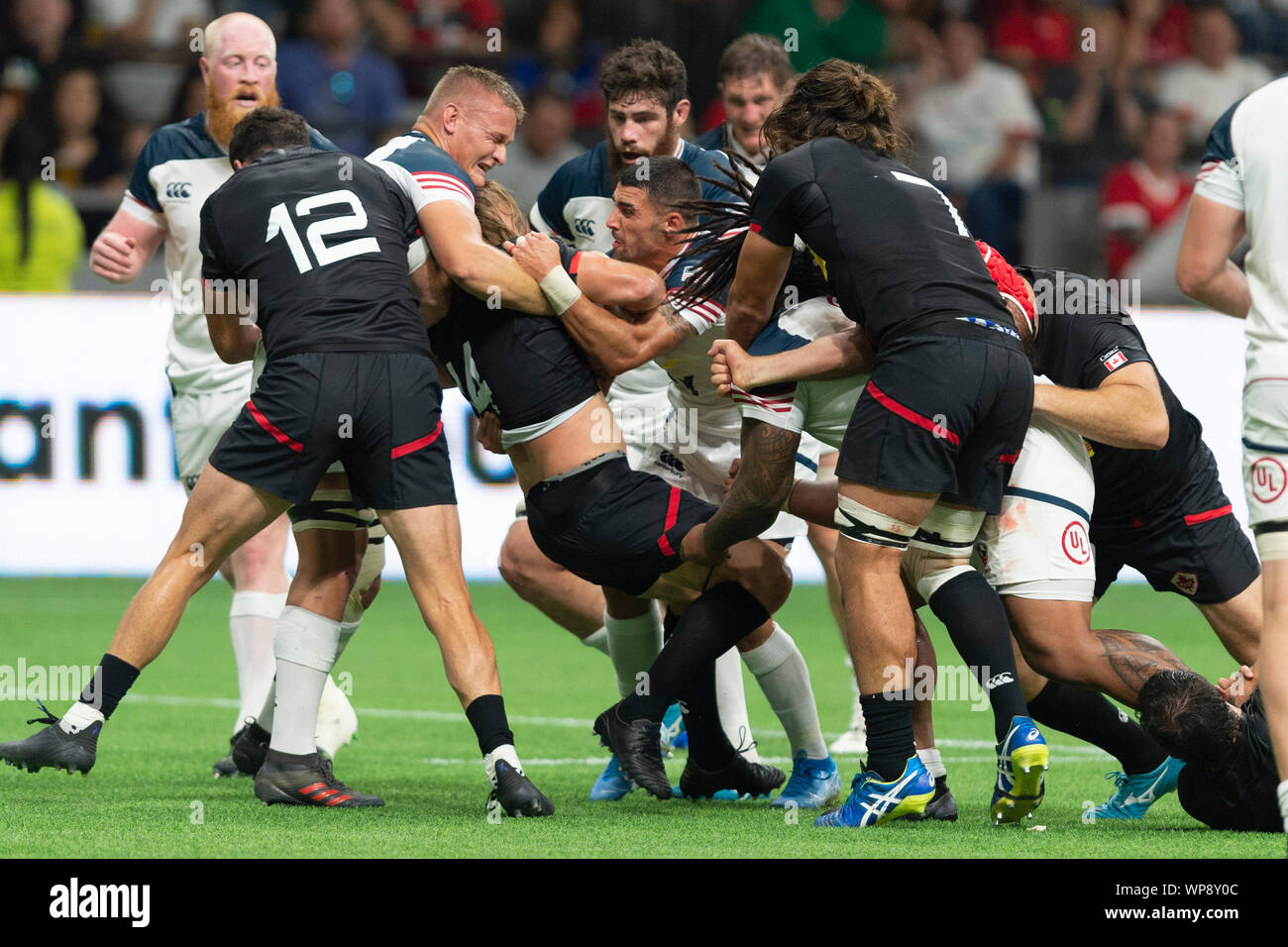 Vancouver, Canada. 7 September, 2019.  Canada Jeff Hassler (14),(black center), being taken down by U.S.A. Hanco Germishuys (7)(left), and U.S.A. Nate Augspurger (9),(right). USA wins 25-15. World Cup Rugby pre-game - Canada vs USA, at BC Place Stadium, Vancouver, Canada. Gerry Rousseau/Alamy Live News Stock Photo