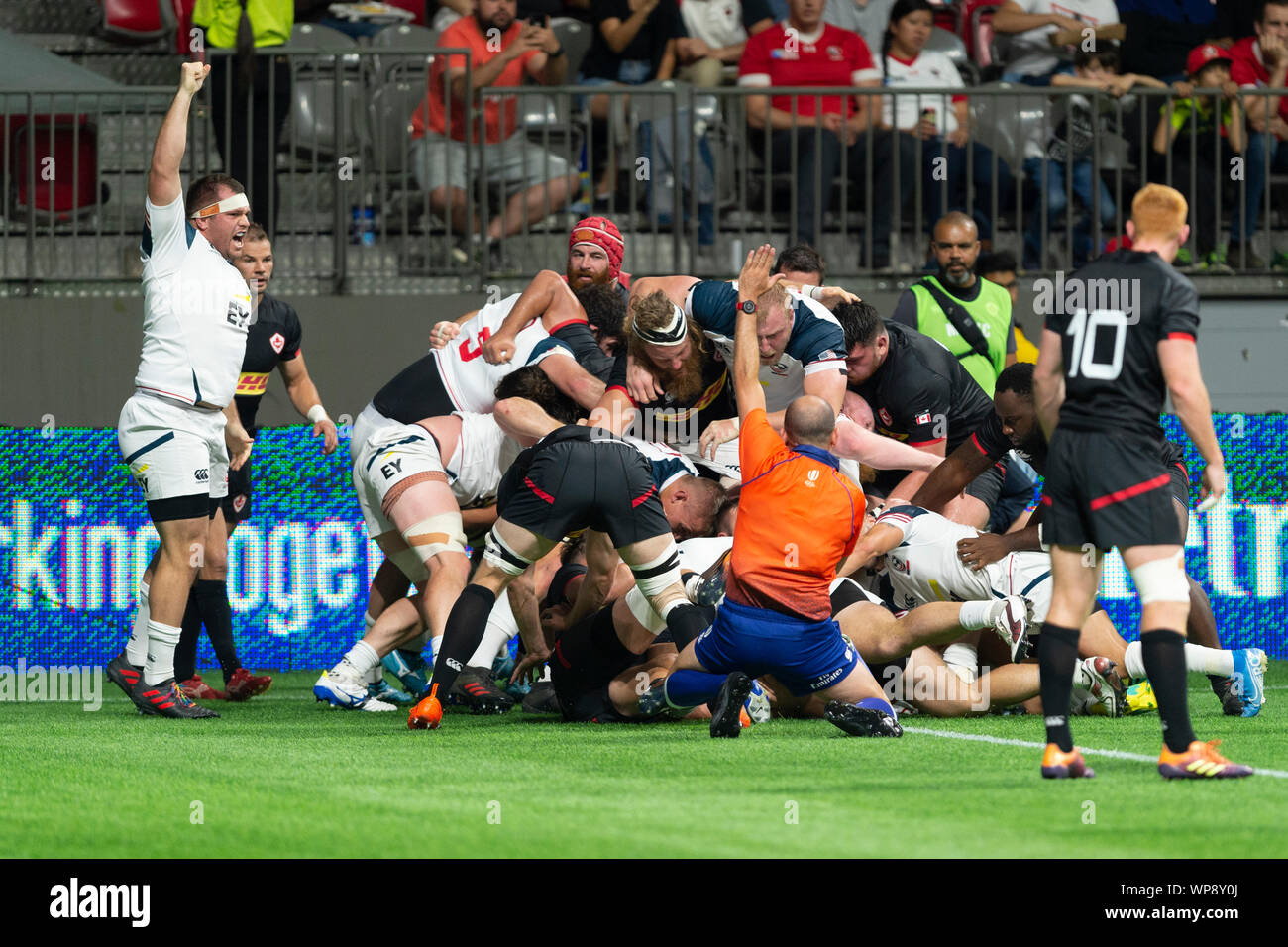 Vancouver, Canada. 7 September, 2019.  Refree signals try by U.S.A. Cam Dolan (8),  buried in a pile of players. USA wins 25-15. World Cup Rugby pre-game - Canada vs USA, at BC Place Stadium, Vancouver, Canada. Gerry Rousseau/Alamy Live News Stock Photo