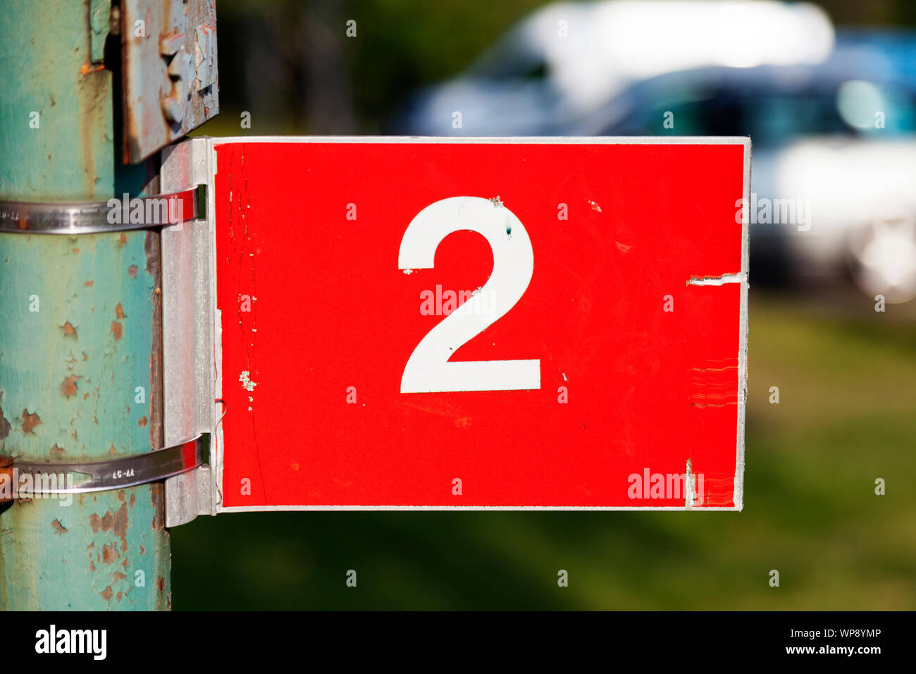 number two on a red sign with reflex numbers in white in Umea Stock Photo